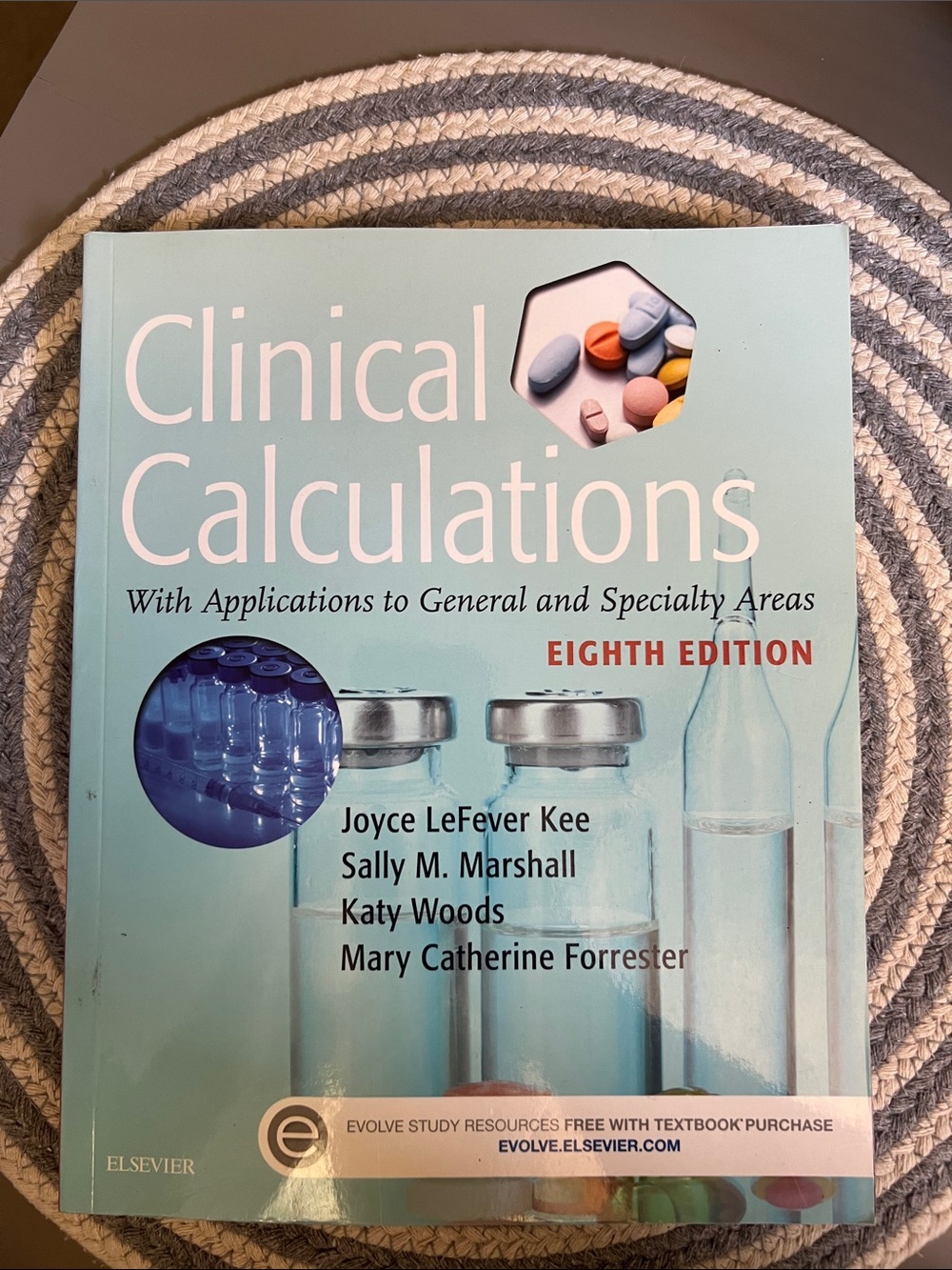 Clinical Calculations Eighth Edition Textbook - Light Aqua Cover